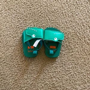 Green crocodile newborn sandals